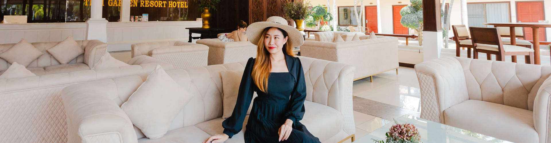 Comfortable lobby at Thai Garden Resort Hotel with woman sitting, welcoming atmosphere