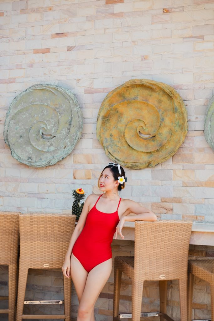 Woman enjoying a drink at the poolside bar of Thai Garden Resort Pattaya.