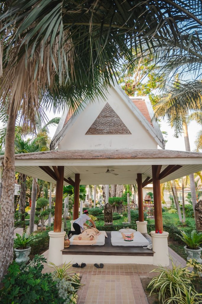 Guest enjoying an outdoor relaxing massage at Thai Garden Resort Pattaya spa