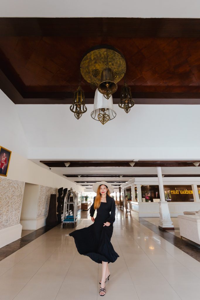 Woman walking through the welcoming lobby at Thai Garden Resort Pattaya