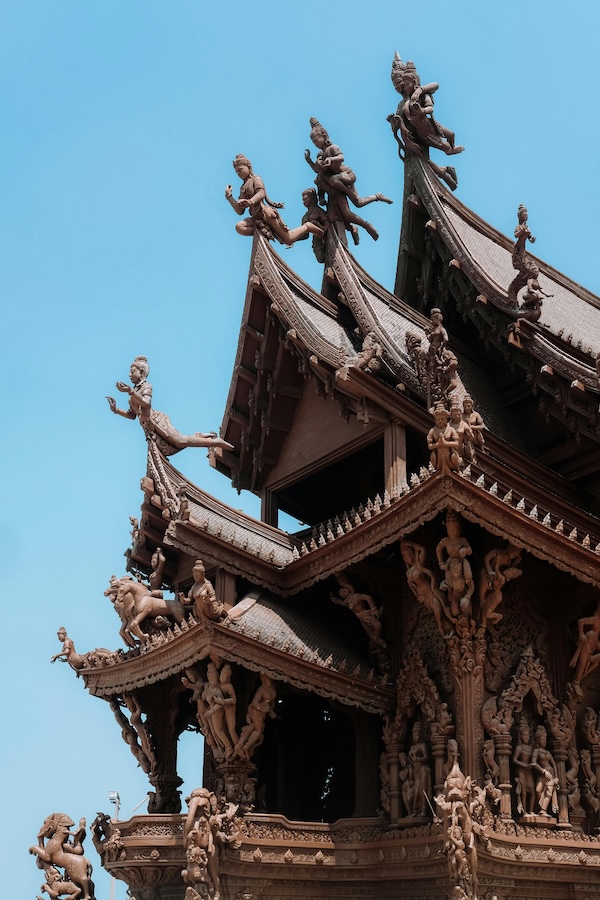 Close-up detail of intricate wood carvings at the Sanctuary of Truth, Pattaya