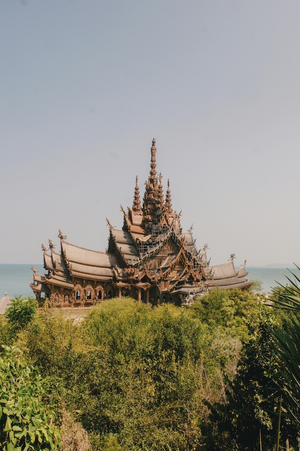 Wide view of the Sanctuary of Truth temple rising above Pattaya’s coastline